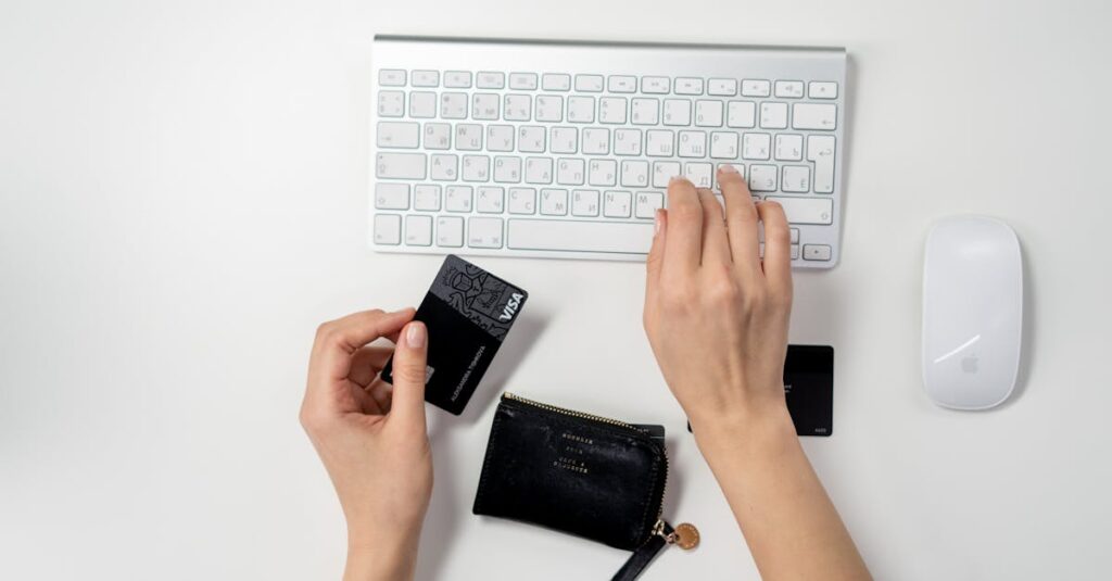 E-commerce setup featuring a keyboard, card, and wallet, ideal for online shopping concepts.
